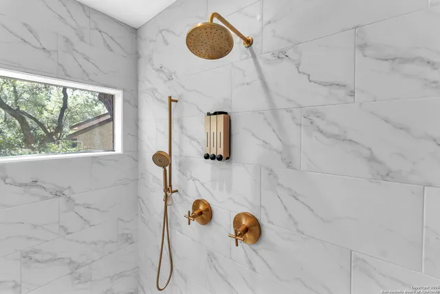 a view of a patio with a table and chairs