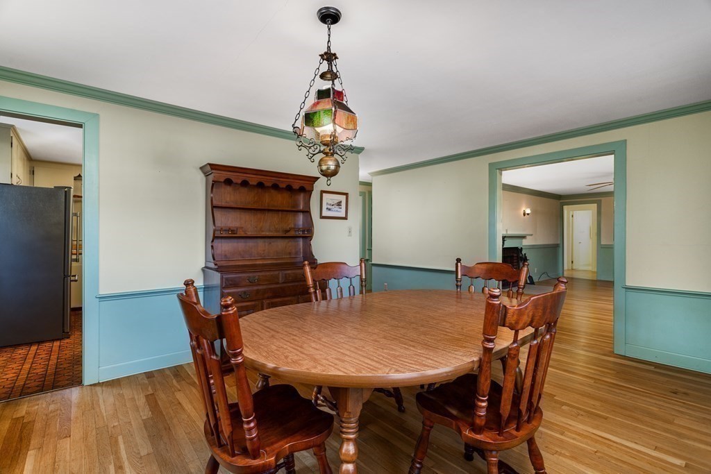 589 Turnpike Road Ashby, MA 01431 - Photo 11 of 40 a view of a dining room with furniture and wooden floor