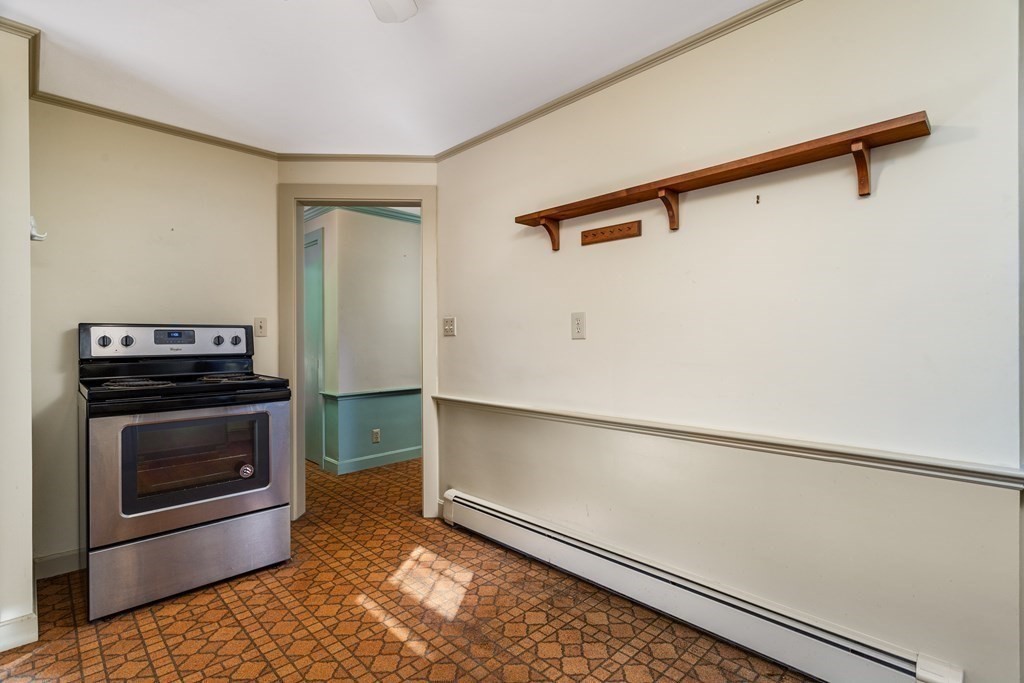 589 Turnpike Road Ashby, MA 01431 - Photo 15 of 40 a kitchen with a refrigerator and a stove top oven