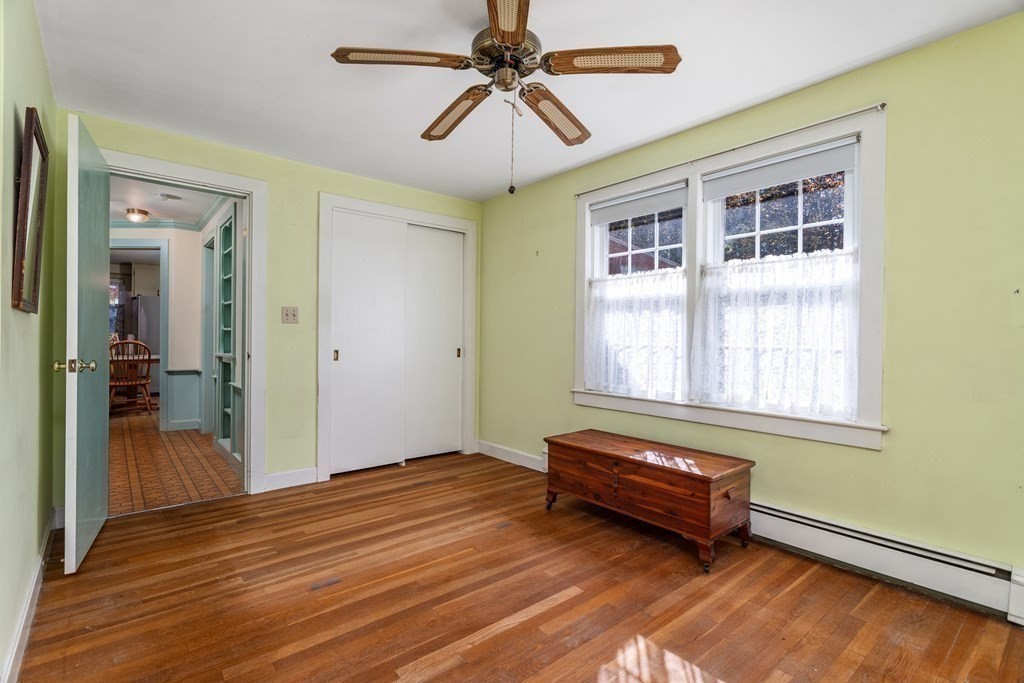 589 Turnpike Road Ashby, MA 01431 - Photo 22 of 40 a living room with a bed furniture and a window