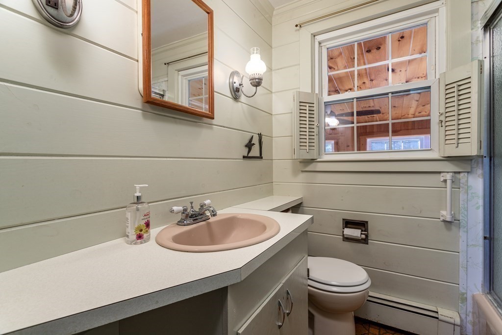 589 Turnpike Road Ashby, MA 01431 - Photo 23 of 40 a bathroom with a sink toilet and a mirror