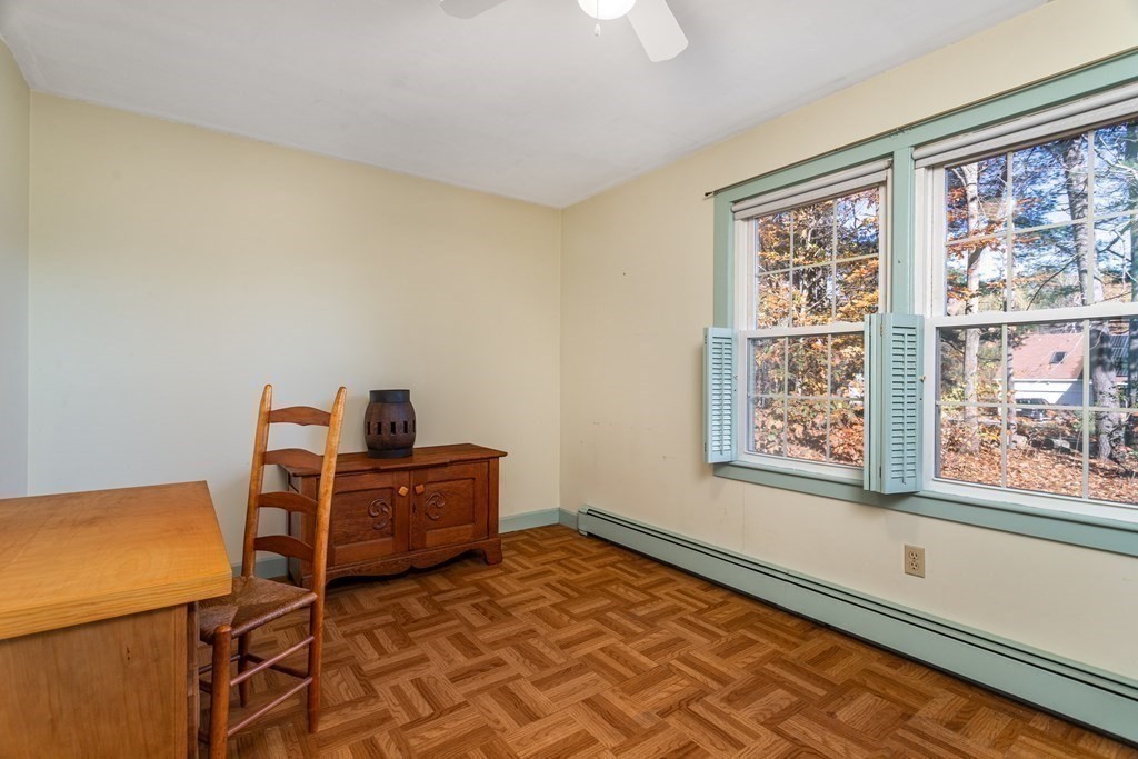 589 Turnpike Road Ashby, MA 01431 - Photo 24 of 40 a living room with furniture and a window