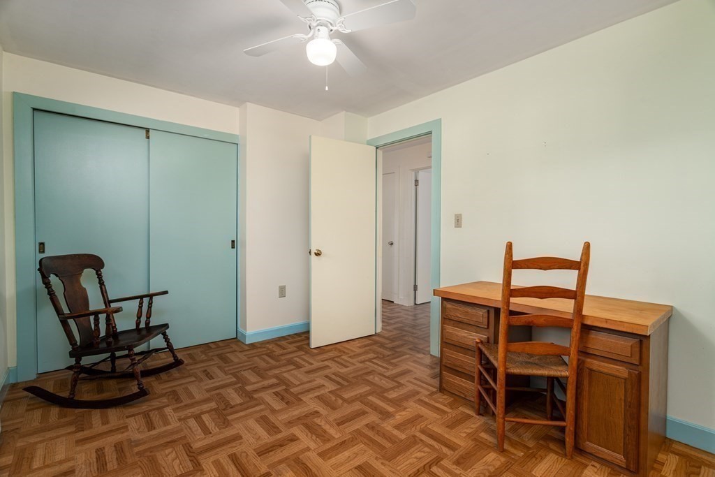 589 Turnpike Road Ashby, MA 01431 - Photo 26 of 40 a bedroom with a bed and a chair