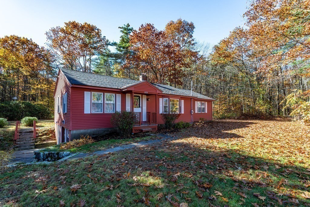 589 Turnpike Road Ashby, MA 01431 - Photo 33 of 40 a view of a yard in front of a house with large trees