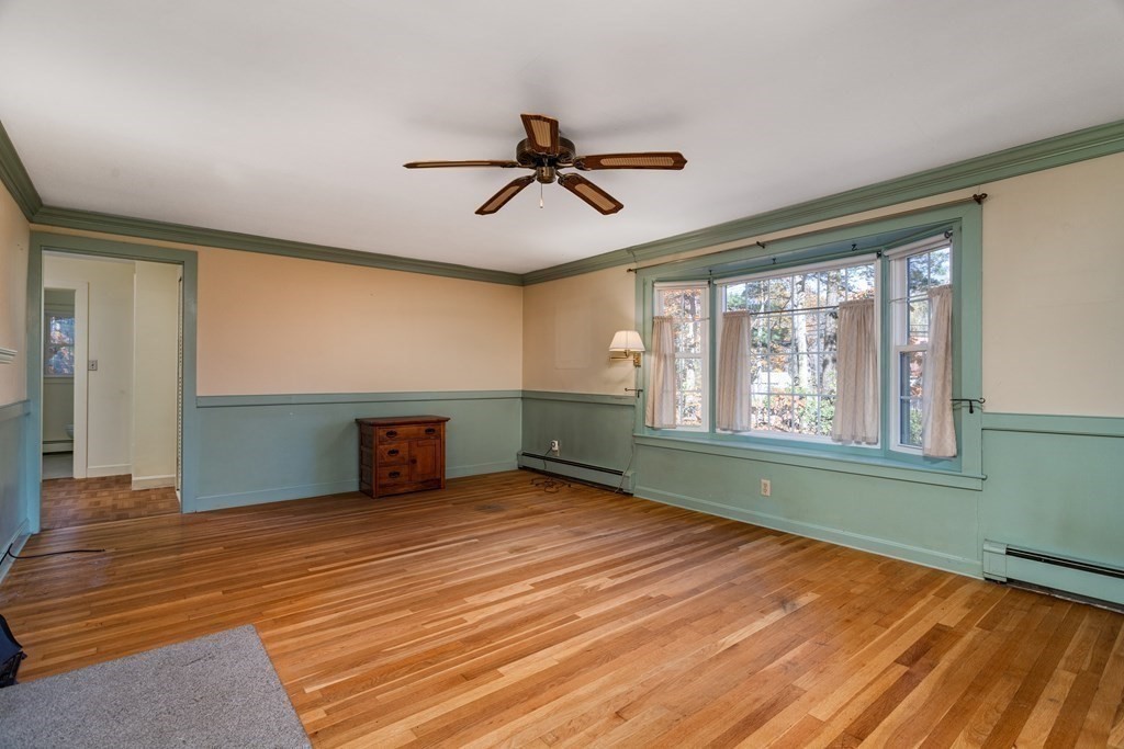 589 Turnpike Road Ashby, MA 01431 - Photo 6 of 40 a view of empty room with wooden floor and fan