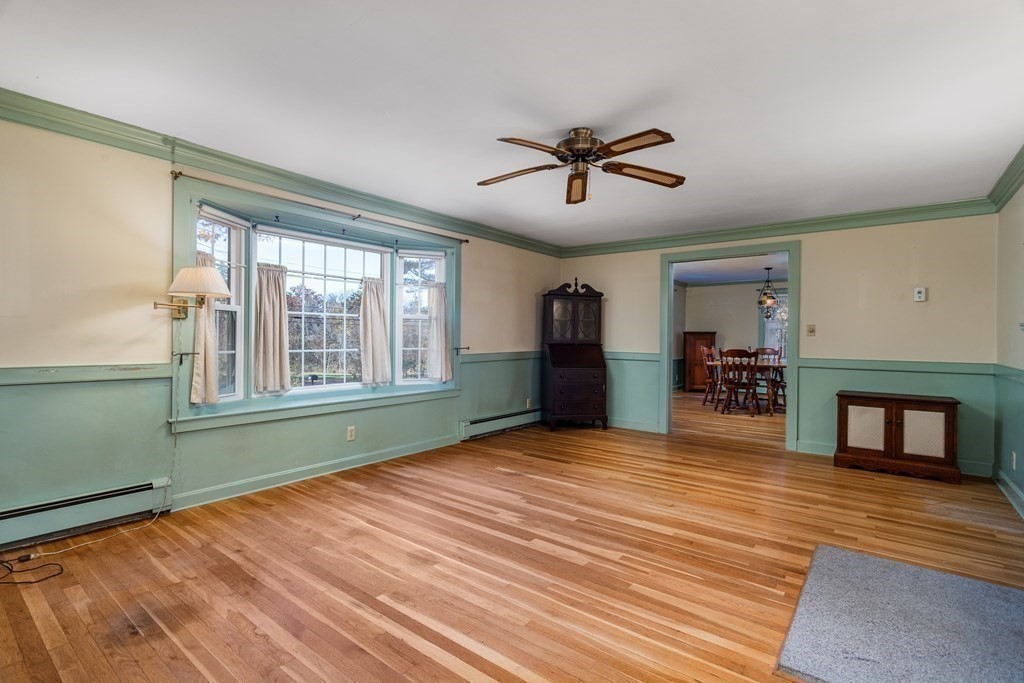 589 Turnpike Road Ashby, MA 01431 - Photo 7 of 40 a view of empty room with wooden floor and fan
