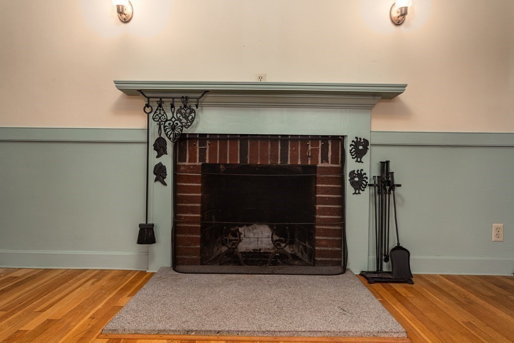 589 Turnpike Road Ashby, MA 01431 - Photo 8 of 40 a bedroom with a bed and a fireplace