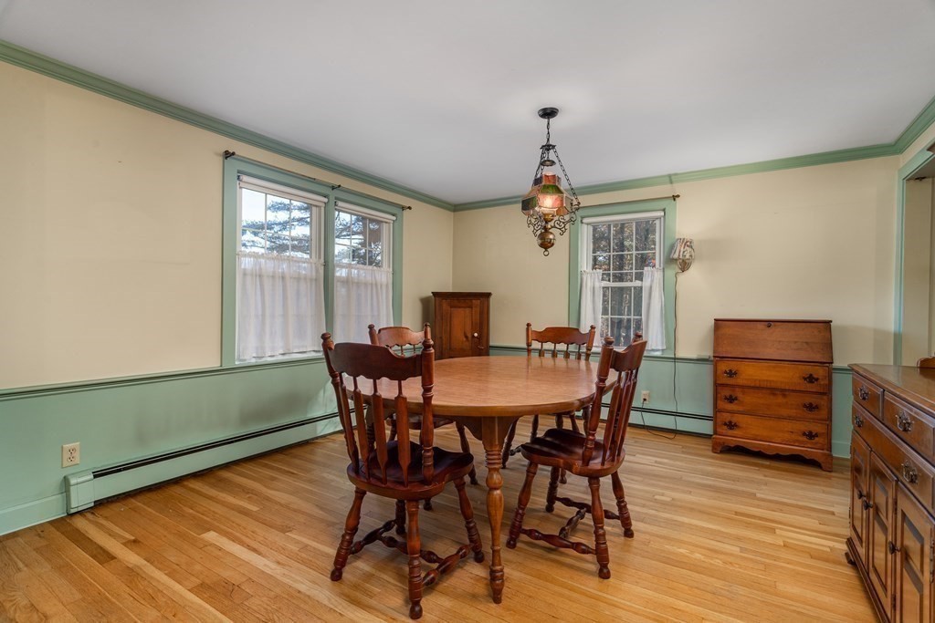 589 Turnpike Road Ashby, MA 01431 - Photo 9 of 40 a view of a dining room with furniture window and wooden floor