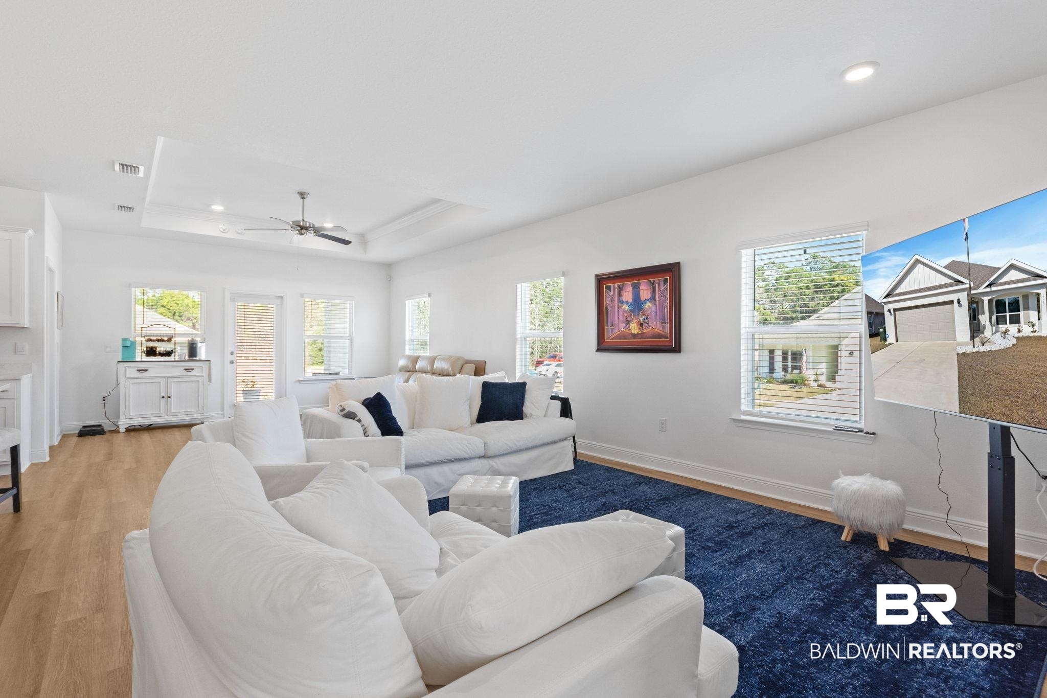 12919 Torrent Road Fairhope, AL 36532 - Photo 16 of 74 Living area with ceiling fan, light wood finished floors, a tray ceiling, and recessed lighting