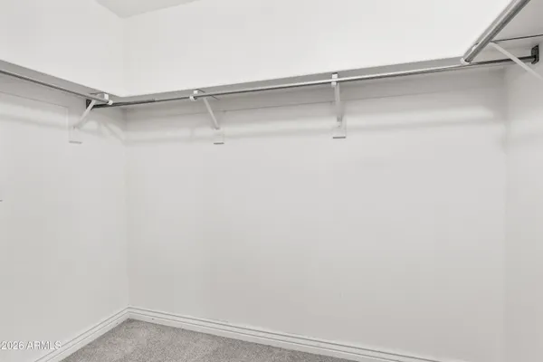a view of an empty walk in closet