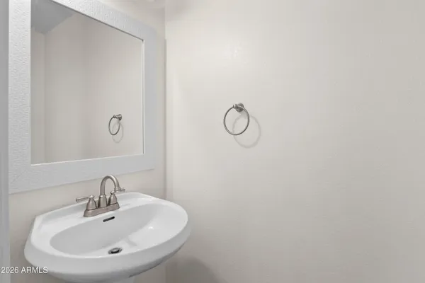a bathroom with a sink and mirror