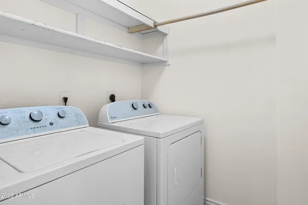 a utility room with dryer and washer