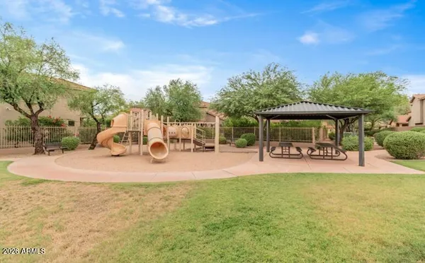 a view of a house with backyard porch and sitting area