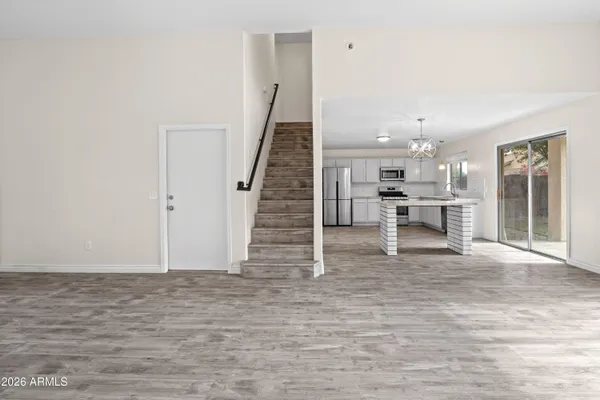 a view of kitchen with furniture and wooden floor
