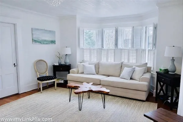a view of an empty room and wooden floor