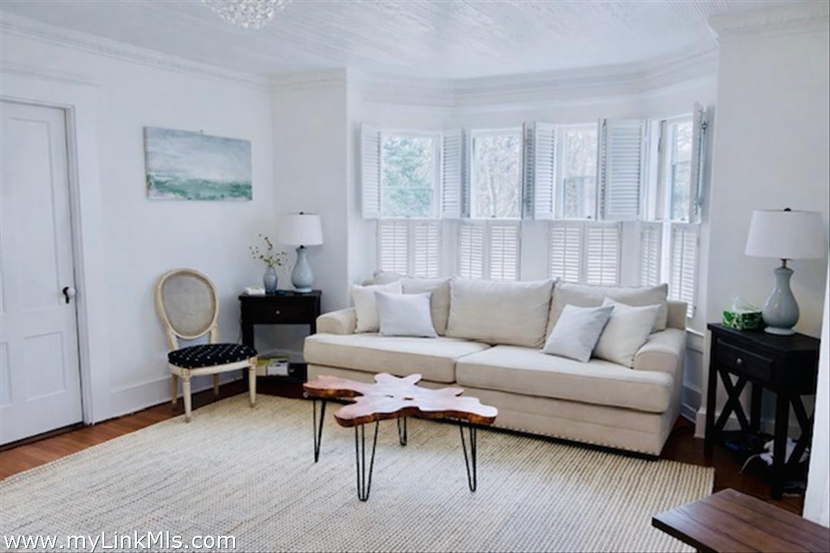 16 S Road Chilmark, MA 02535 - Photo 18 of 30 a living room with furniture and a lamp