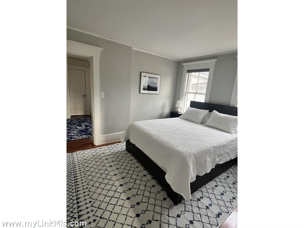 16 S Road Chilmark, MA 02535 - Photo 22 of 30 a bedroom with a bed and a window