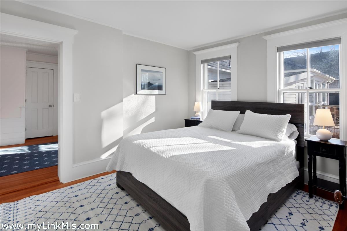 16 S Road Chilmark, MA 02535 - Photo 23 of 30 a bedroom with a bed and wooden floor