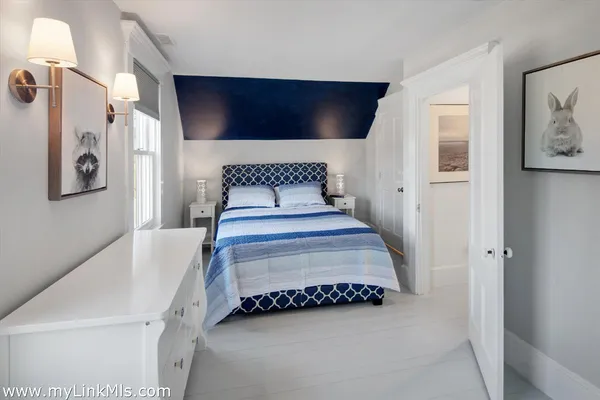 a bathroom with a tub shower and window