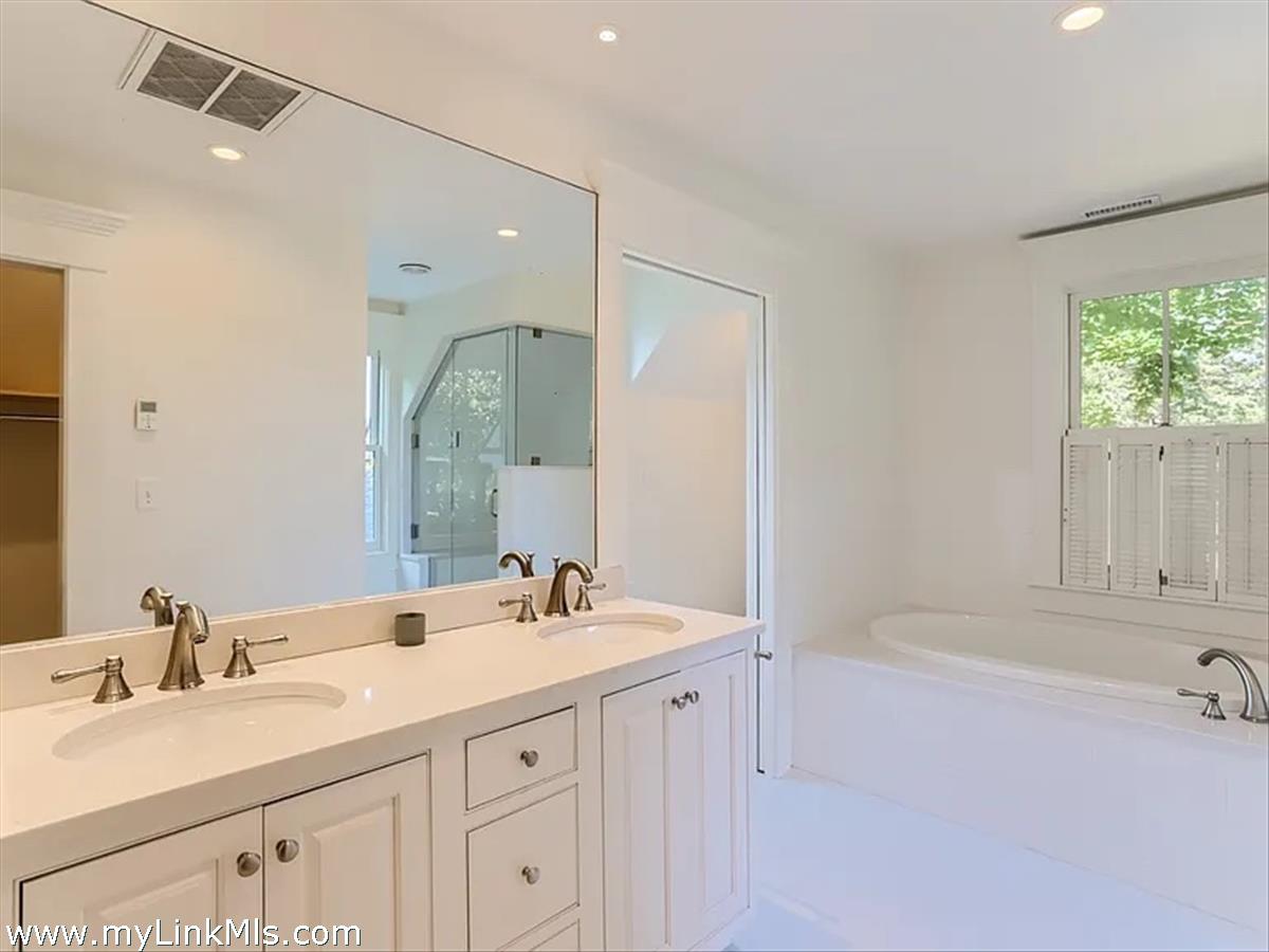 16 S Road Chilmark, MA 02535 - Photo 28 of 30 a bathroom with a sink double vanity and a mirror