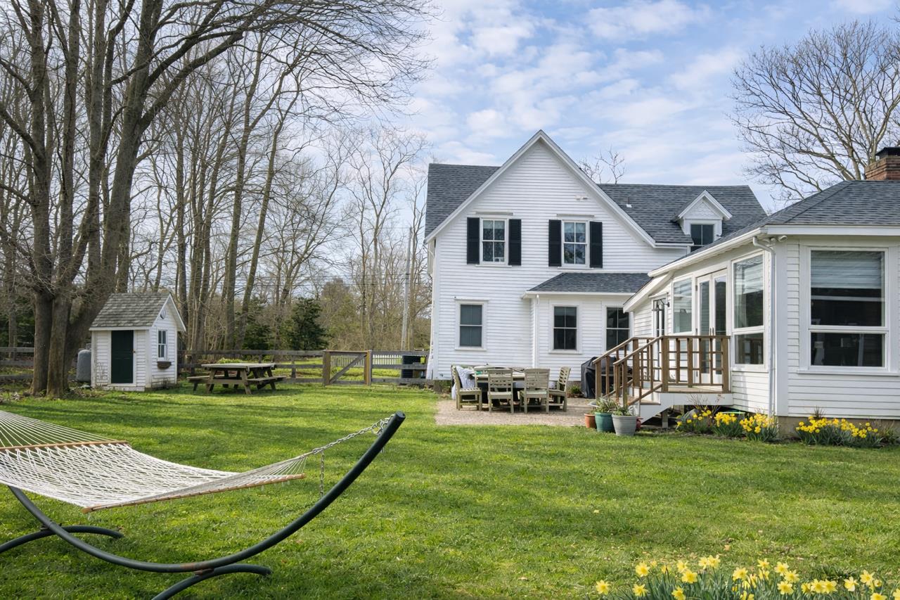 16 S Road Chilmark, MA 02535 - Photo 4 of 30 a front view of a house with a yard