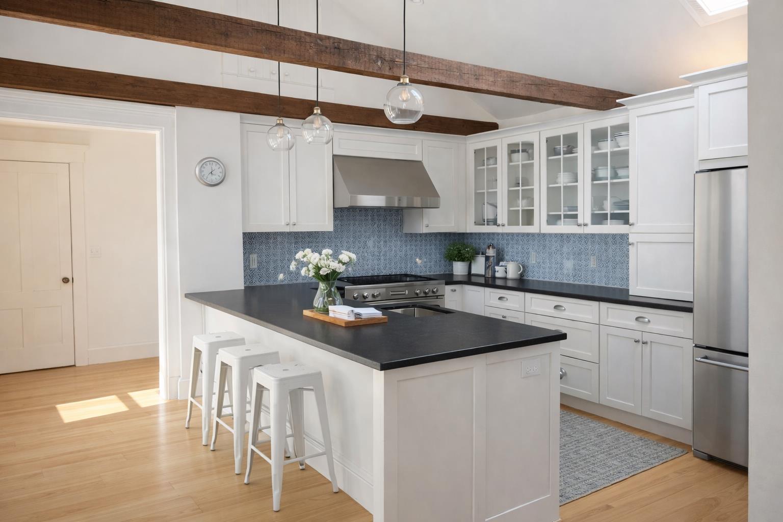 16 S Road Chilmark, MA 02535 - Photo 10 of 30 a kitchen with stainless steel appliances granite countertop a sink a stove and a refrigerator