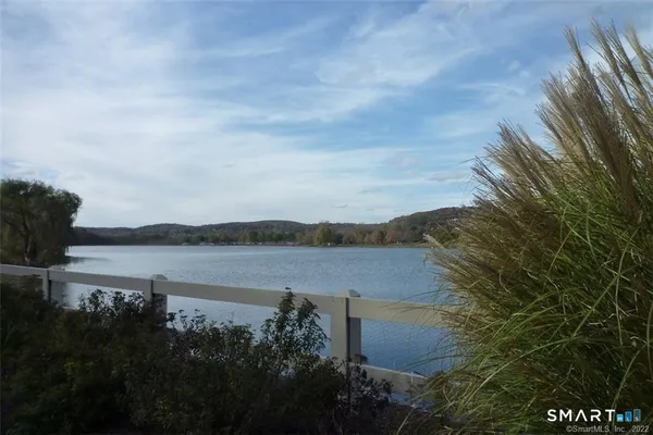 a view of lake with mountain in the background