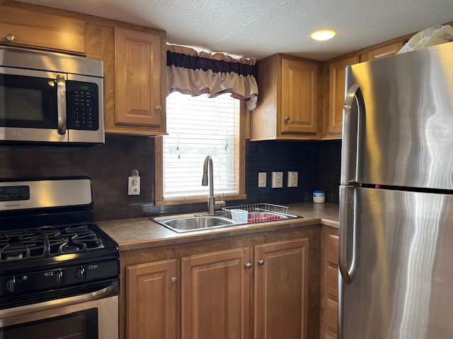 2795 East 28th Road Marseilles, IL 61341 - Photo 11 of 22 a kitchen with stainless steel appliances granite countertop a refrigerator stove and sink