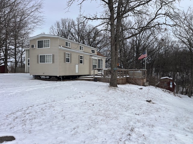 2795 East 28th Road Marseilles, IL 61341 - Photo 3 of 22 a front view of a house with a yard covered in snow