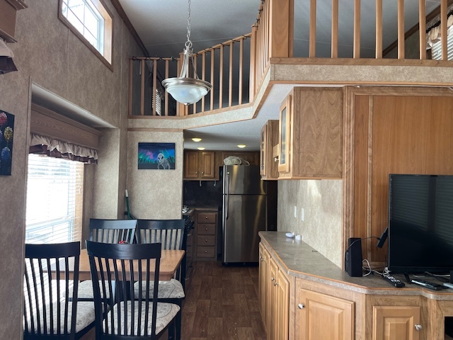 2795 East 28th Road Marseilles, IL 61341 - Photo 4 of 22 a kitchen with stainless steel appliances granite countertop a refrigerator a stove a sink dishwasher and wooden cabinets with wooden floor