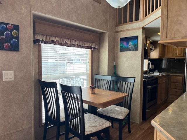 2795 East 28th Road Marseilles, IL 61341 - Photo 7 of 22 a view of a dining room with furniture and a large window