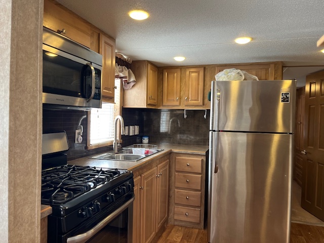 2795 East 28th Road Marseilles, IL 61341 - Photo 8 of 22 a kitchen with stainless steel appliances granite countertop a refrigerator stove and microwave