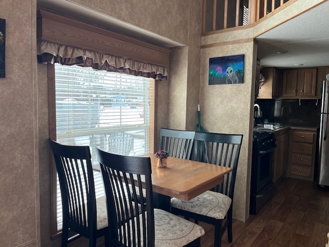 2795 East 28th Road Marseilles, IL 61341 - Photo 10 of 22 a view of a dining room with furniture window and wooden floor