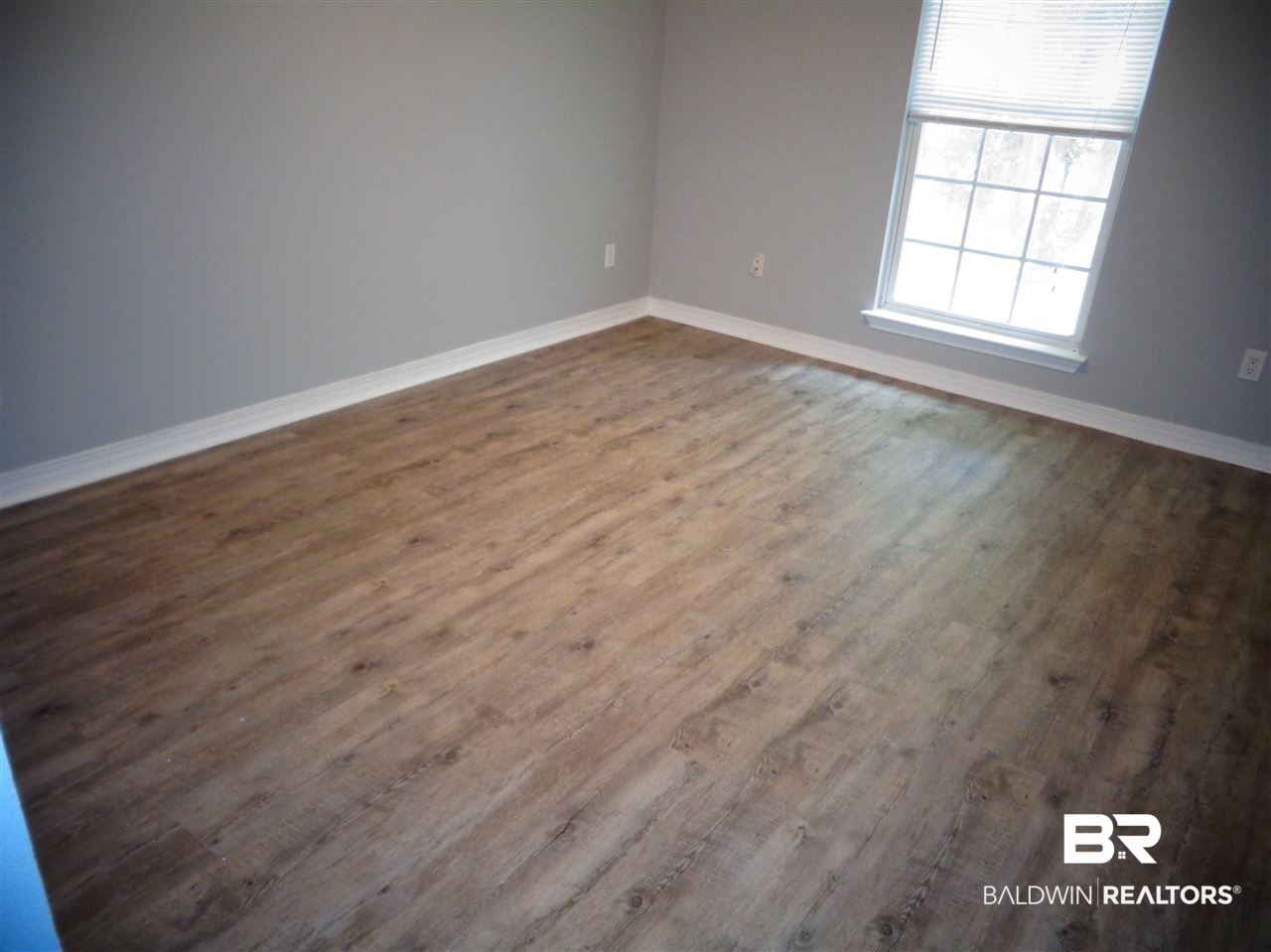 27020 Lake Road Orange Beach, AL 36561 - Photo 23 of 30 Front Bedroom. 14x12. New floor.