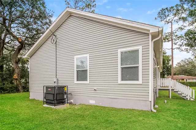 a view of a house with a backyard