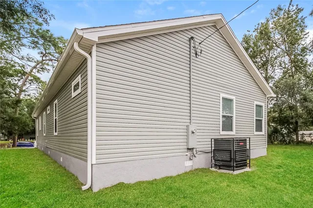 a view of a house with a yard and garage