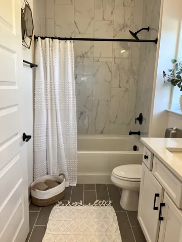 a bathroom with a sink a toilet and a bathtub