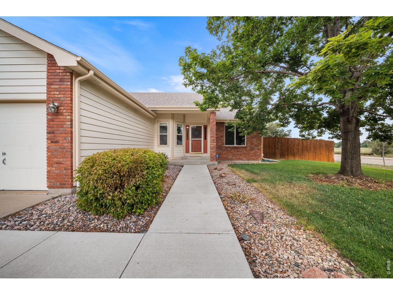 4014 Carrick Road Fort Collins, CO 80525 - Photo 2 of 41 Covered front porch and inviting walkway with established trees