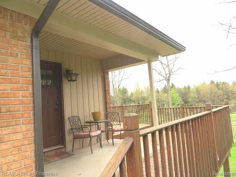 7095 Colonial Way Howell, MI 48855 - Photo 6 of 61 new side image.jpg