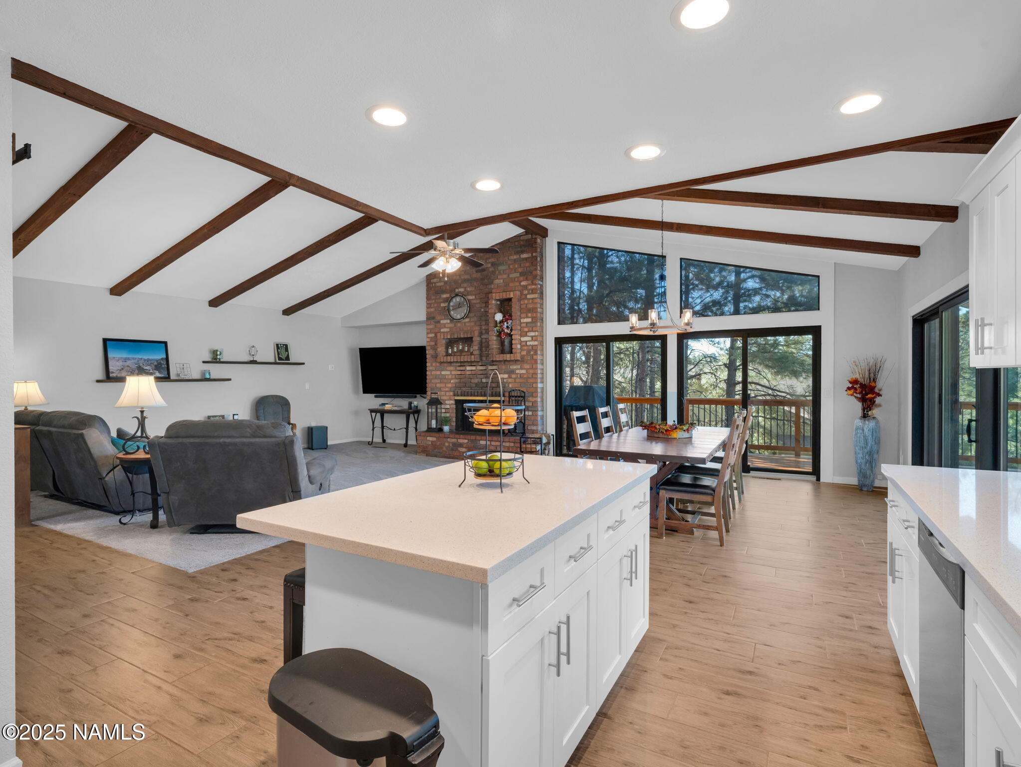 2201 North Fox Hill Road Flagstaff, AZ 86004 - Photo 1 of 38 a view of living room with furniture a flat screen tv and a large window