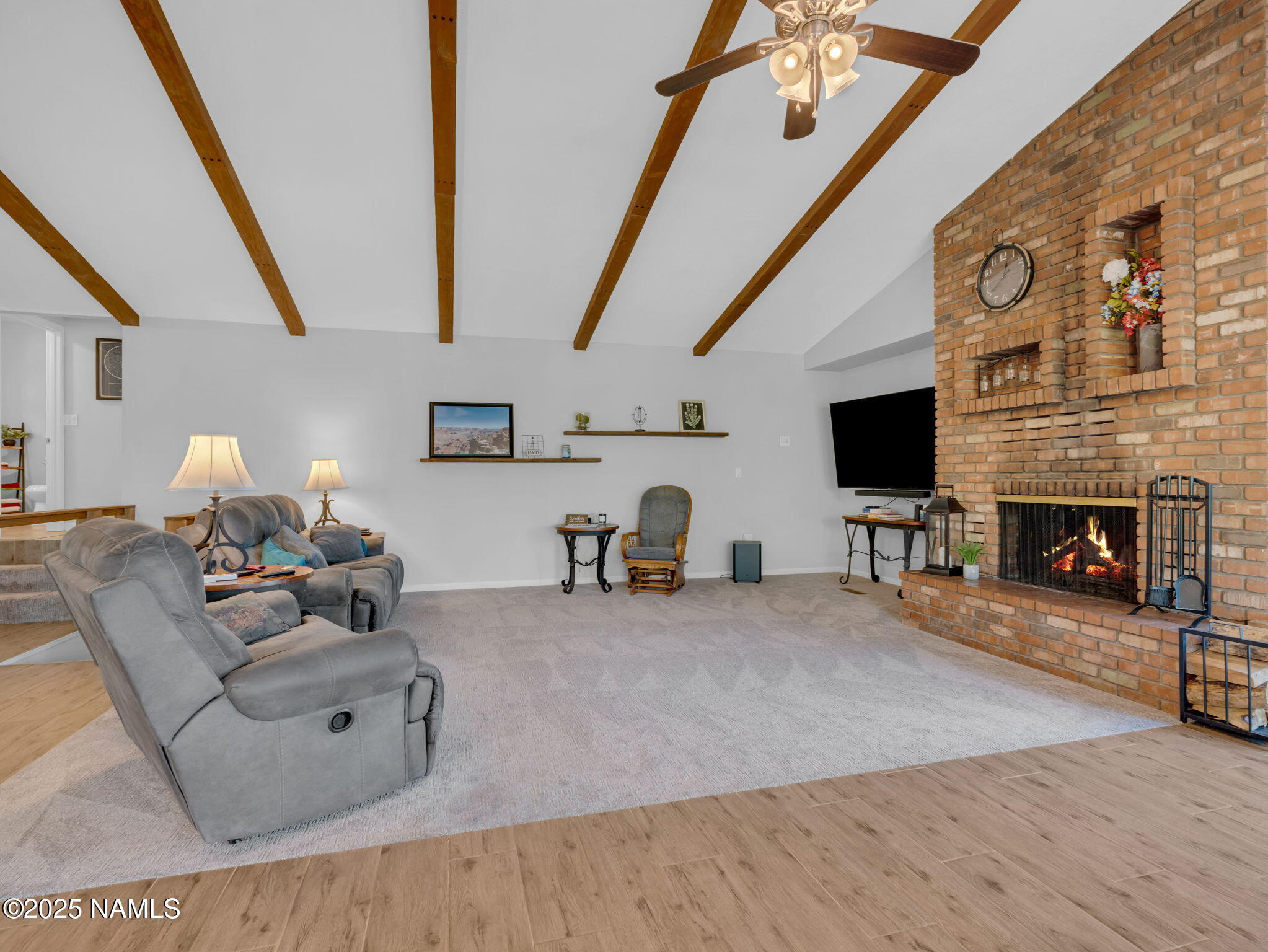 2201 North Fox Hill Road Flagstaff, AZ 86004 - Photo 11 of 38 a living room with furniture and a fireplace