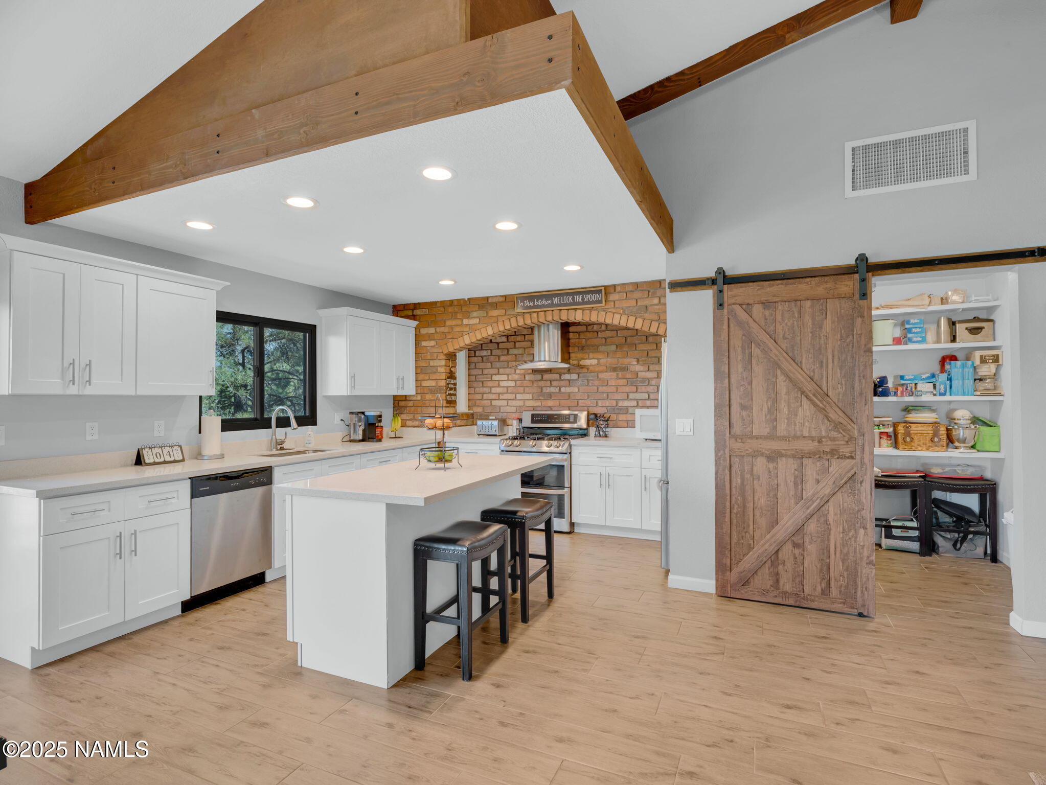 2201 North Fox Hill Road Flagstaff, AZ 86004 - Photo 12 of 38 a kitchen with a sink a counter top space and stainless steel appliances