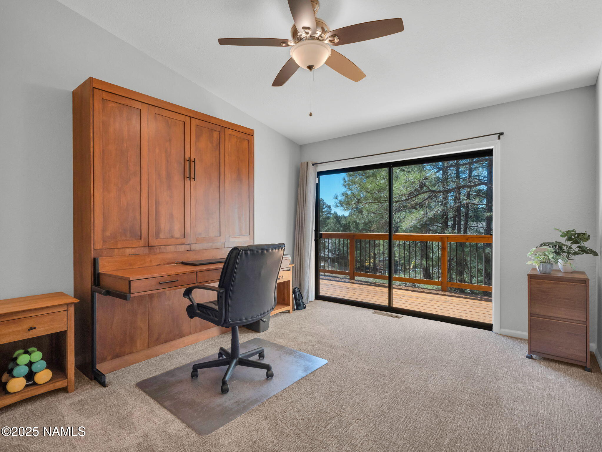 2201 North Fox Hill Road Flagstaff, AZ 86004 - Photo 22 of 38 a view of a livingroom with workspace and a window