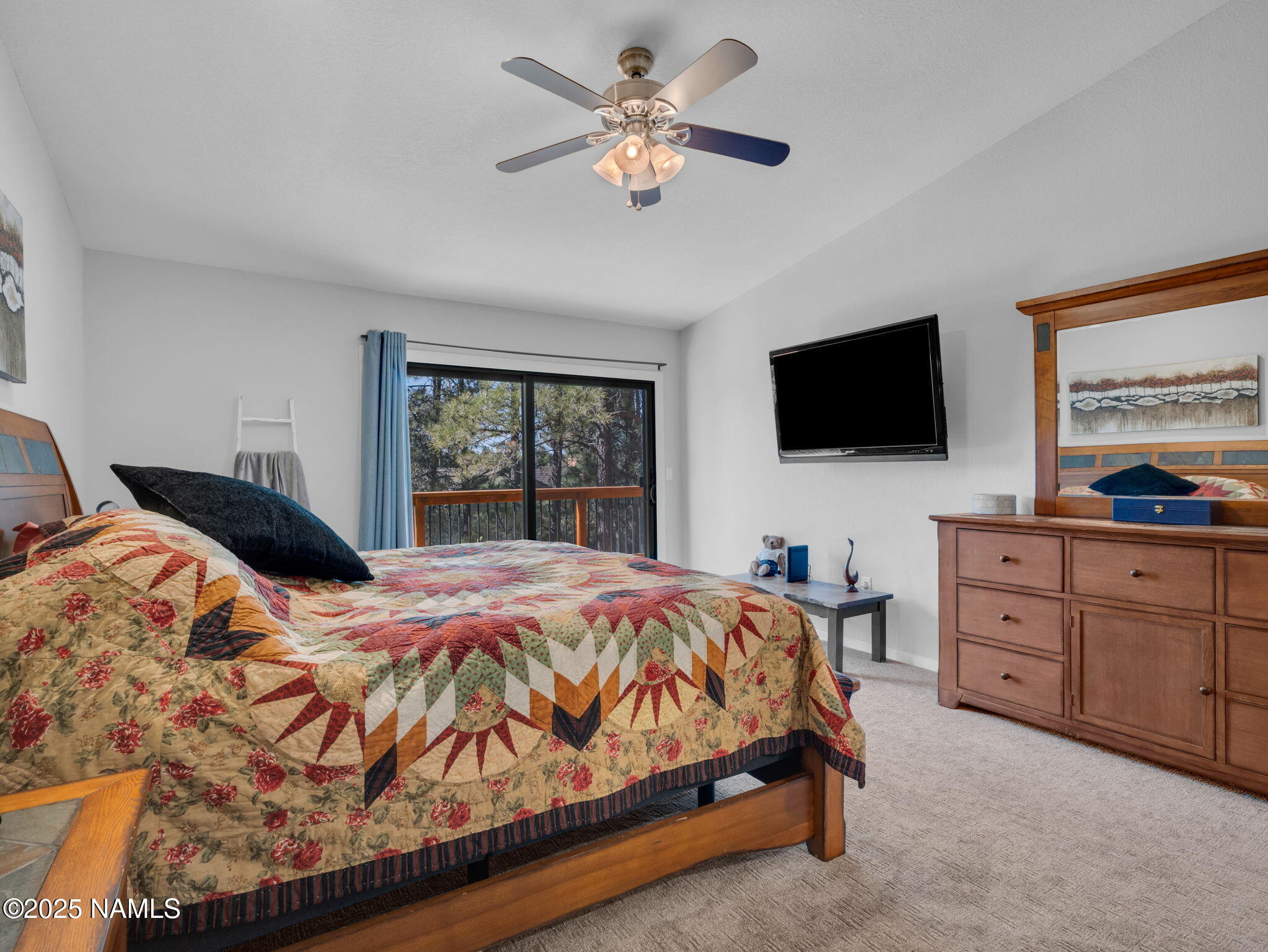 2201 North Fox Hill Road Flagstaff, AZ 86004 - Photo 25 of 38 a bedroom with a bed and a flat screen tv