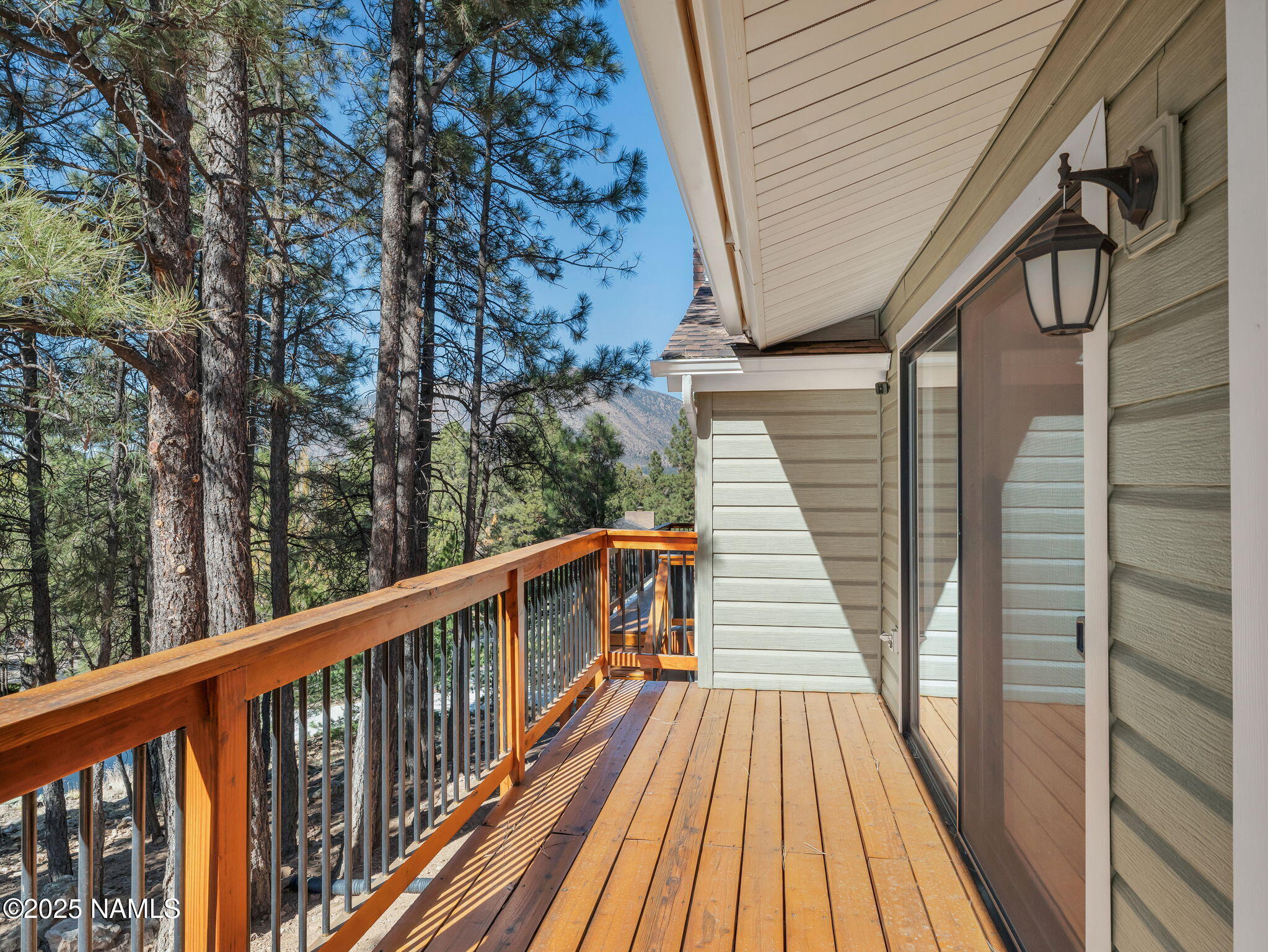 2201 North Fox Hill Road Flagstaff, AZ 86004 - Photo 26 of 38 a balcony with wooden floor and fence