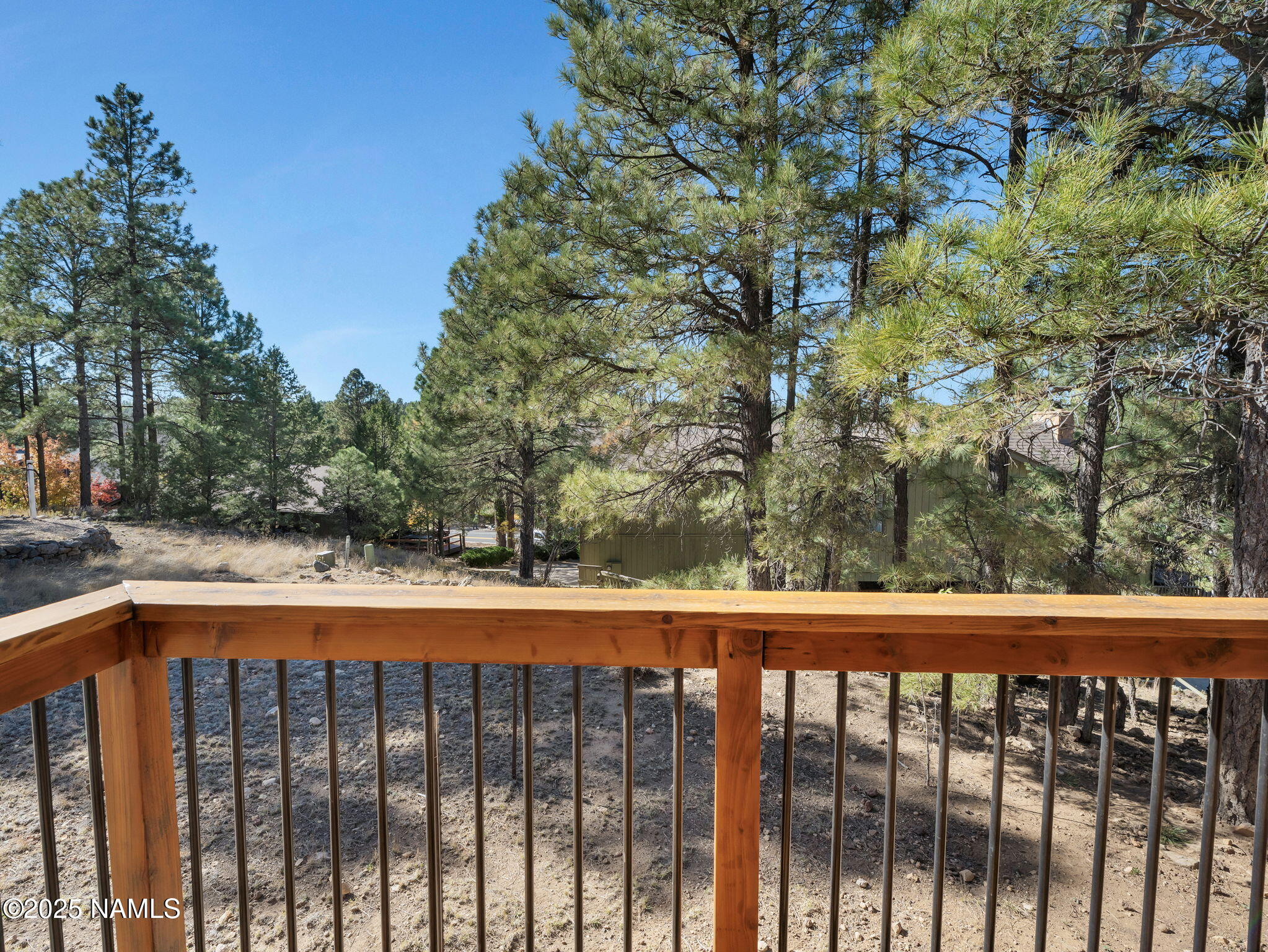 2201 North Fox Hill Road Flagstaff, AZ 86004 - Photo 27 of 38 a balcony with trees in front of it