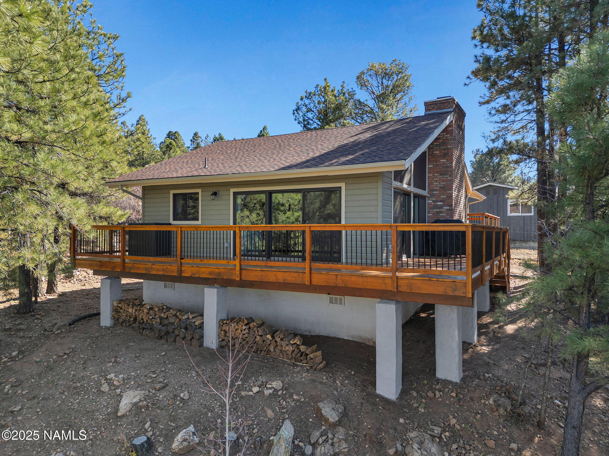 2201 North Fox Hill Road Flagstaff, AZ 86004 - Photo 37 of 38 a view of a house with a yard and sitting area