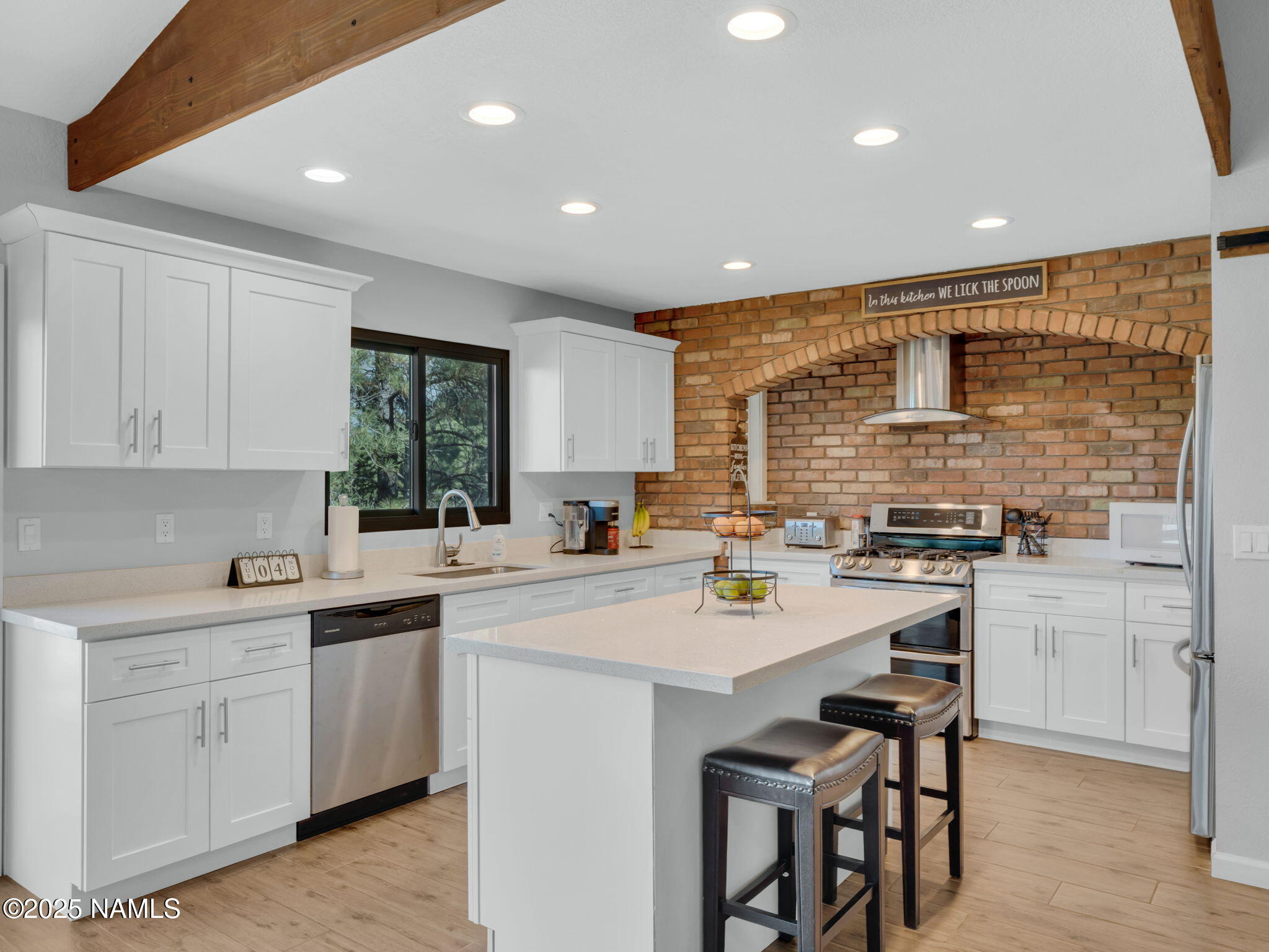 2201 North Fox Hill Road Flagstaff, AZ 86004 - Photo 4 of 38 a kitchen with appliances a sink cabinets and a counter top space