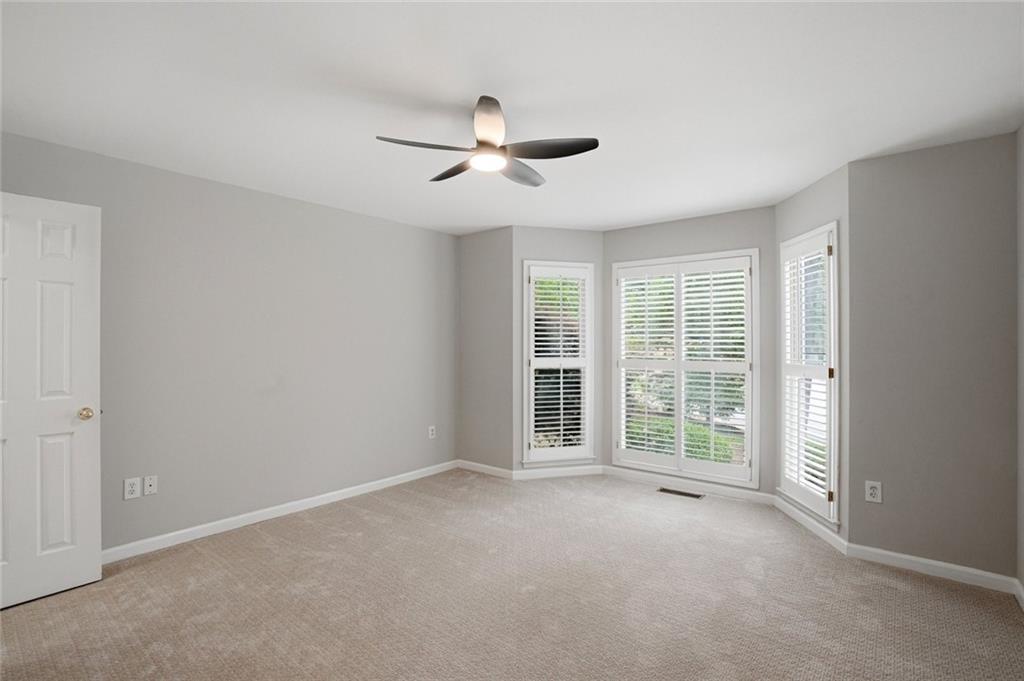 13 Bedford Ridge Northwest Cartersville, GA 30121 - Photo 9 of 19 a view of a livingroom with a ceiling fan and windows