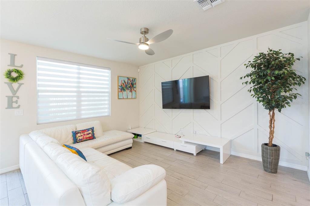 2760 Emory Sound Place Brandon, FL 33510 - Photo 19 of 52 a living room with furniture and a flat screen tv